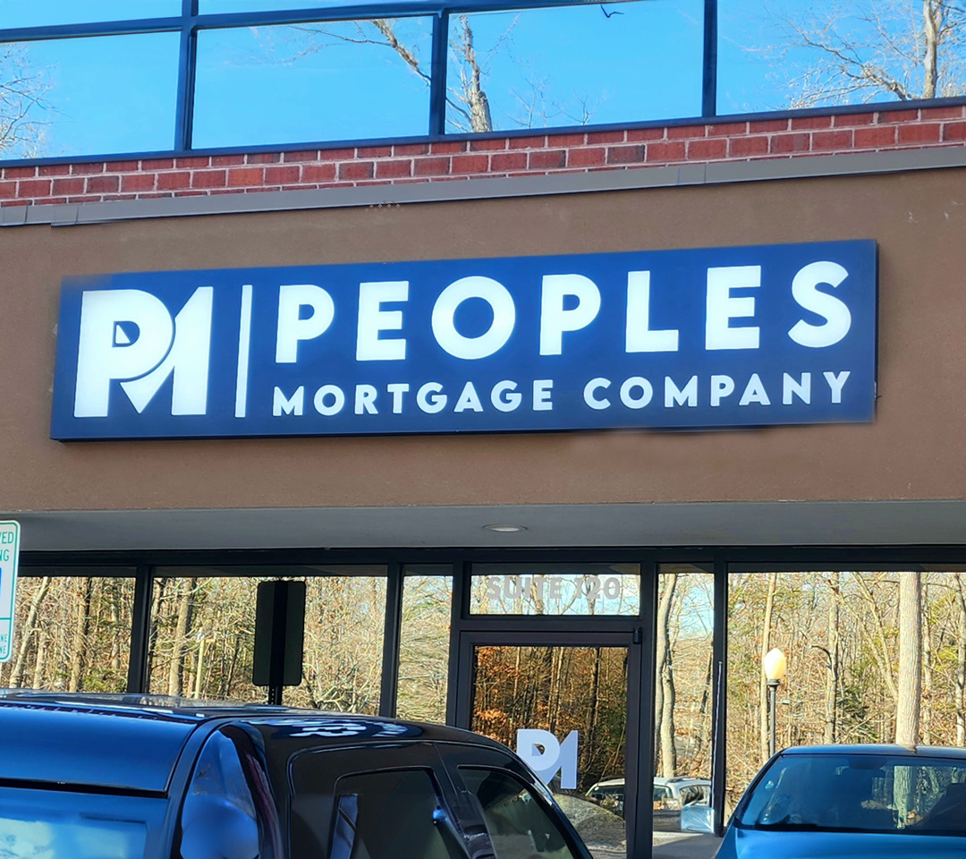 Illuminated sign cabinet installed by Distinct Sign Solutions for Peoples Mortgage Company in Fredericksburg, VA. Modern exterior signage for increased street-level visibility.